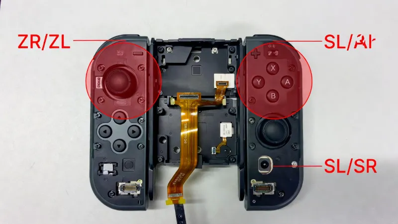 Diagram showing critical ribbon cable locations inside a Joy-Con that can get pinched during reassembly causing button failure
