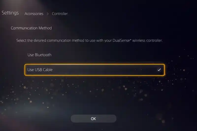 PS5 settings menu showing Communication Method changed from Bluetooth to Use USB Cable